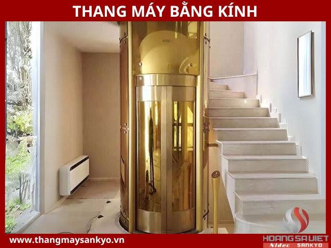 Glass elevator model covered with gold paint
